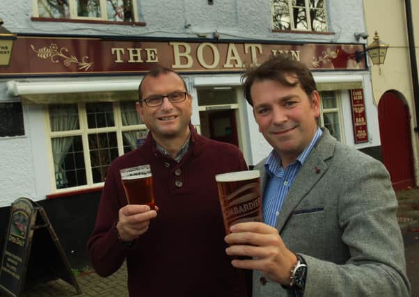 Melton Council deputy leader, Councillor Leigh Higgins (right), who is keen to boost the viability of local pubs, pictured with Kevin Billson, of Melton CAMRA, before the recent lockdown EMN-200624-121555001
