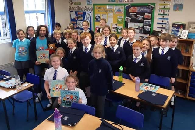 Body coach Joe Wicks visits Buckminster Primary School to promote his new children's book EMN-211110-130428001