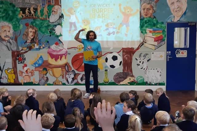 Body coach Joe Wicks visits Buckminster Primary School to promote his new children's book EMN-211110-130438001