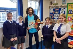Body coach Joe Wicks visits Buckminster Primary School to promote his new children's book EMN-211110-130448001