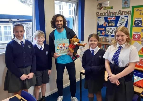 Body coach Joe Wicks visits Buckminster Primary School to promote his new children's book EMN-211110-130448001