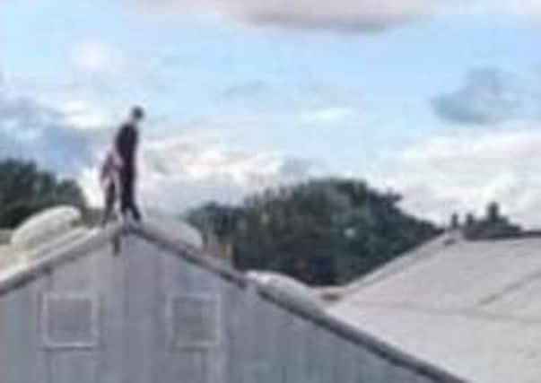 Children spotted on the roof of a Melton town centre building - police have issued a warning about the dangers of this behaviour EMN-211018-175036001