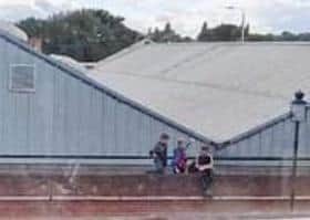 Children spotted on the roof of a Melton town centre building - police have issued a warning about the dangers of this behaviour EMN-211018-175046001