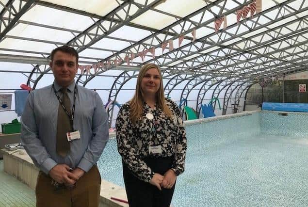 Nathan Odom, head of estates and admissions for Discovery Schools, and Sarah Sadler, executive head at Asfordby Captain's Close School, pictured by the school swimming pool EMN-211019-155142001