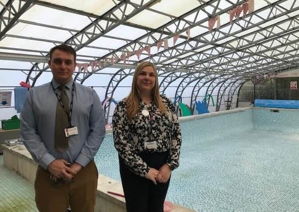 Nathan Odom, head of estates and admissions for Discovery Schools, and Sarah Sadler, executive head at Asfordby Captain's Close School, pictured by the school swimming pool EMN-211019-155142001