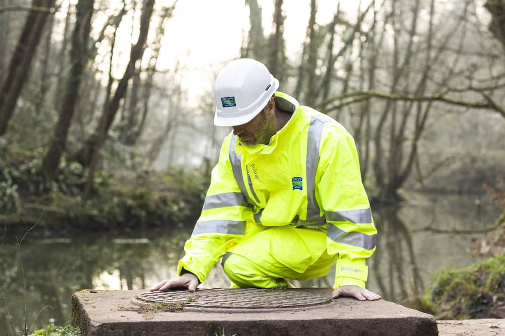 A Severn Trent worker making river checks EMN-211026-124537001