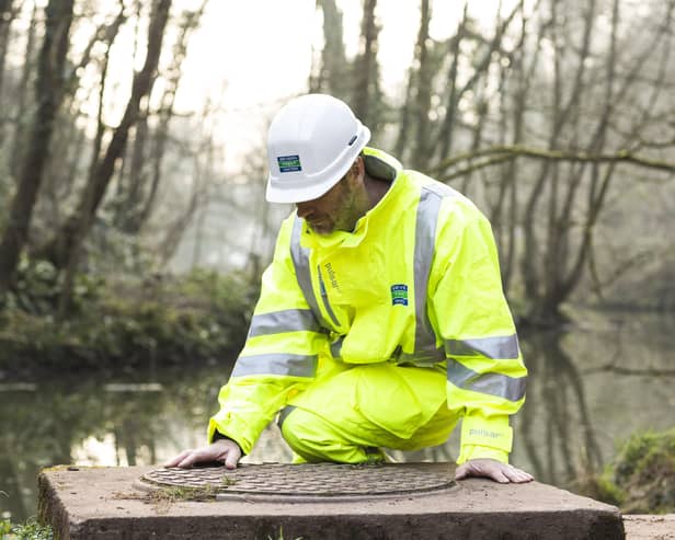 A Severn Trent worker making river checks EMN-211026-124537001