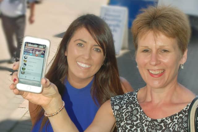 Melton BID promoting a new Melton town centre app back in 2018 - manager Shelagh Core (right) pictured with Siobhan Lane, o RS Bridal Collection EMN-211029-164446001