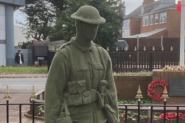 A stunning knitted soldier which has been place anonymously at Syston War Memorial Clock Tower to mark Remembrance week EMN-210911-095222001