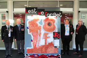 The Remembrance display created by students and staff at Melton's John Ferneley College with, from left, Melton Royal British Legion branch members Danny O'Brien and Peter Roffey, Mayor of Melton, Councillor Peter Faulkner, and school head of design technology, Sharon Rowell EMN-210911-095309001