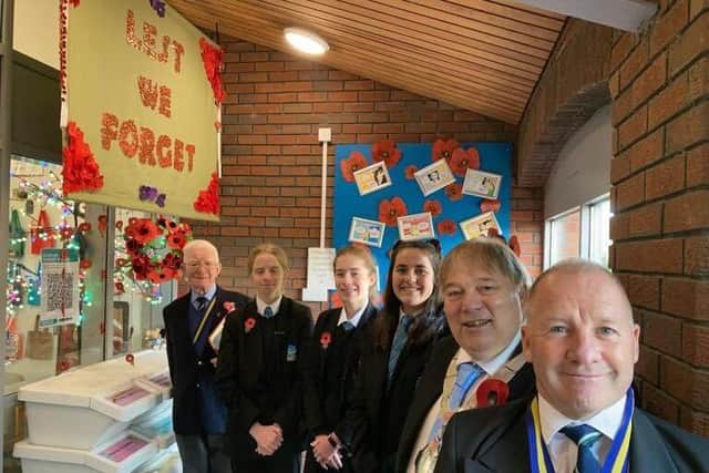 Students at Long Field Spencer Academy, Talikser Freeman, Ellie Yates and Alex Bridgeman, show off their special Remembrance display with, from left, Melton Royal British Legion branch president Peter Roffey, Mayor of Melton, Councillor Peter Faulkner, and local Legion chair Danny O'Brien and EMN-210911-095333001