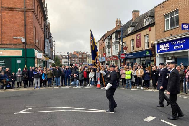 Today's Remembrance Sunday parade through Melton Mowbray town centre EMN-211114-173314001