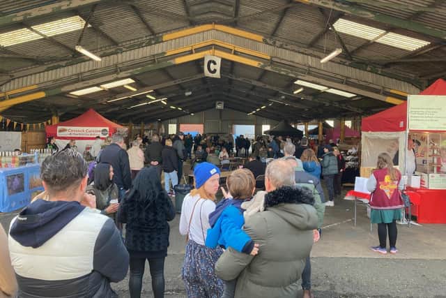 Attendees at Sunday's ChocFest fall silent as the Last Post is played over the tannoy at Melton Livestock Market at 11am to mark Remembrance Sunday EMN-211115-105727001