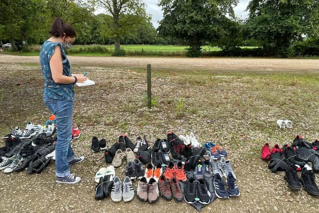 Charity voilunteer Helen Cliff pictured in September with donated footwear for the refugees at Scalford Country House Hotel EMN-211123-110421001