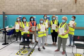 Some of the members of the team at the vaccination centre at Melton Sports Village holding 'thankyou' certificates, which were given to each team member by the local Primary Care Network EMN-211125-094028001