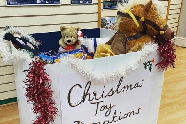 A collection box at Bentons of Melton, for donations towards Lisa Godber's Christmas toy appeal EMN-211126-112521001