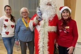 Melton Re-Engage co-ordinator Rachel Wade (left) with Pam Posnett (Vice President of Melton Belvior Rotary Club) and organiser Patricia Wood at their Christmas tea party at Rearsby Village Hall EMN-210612-092407001