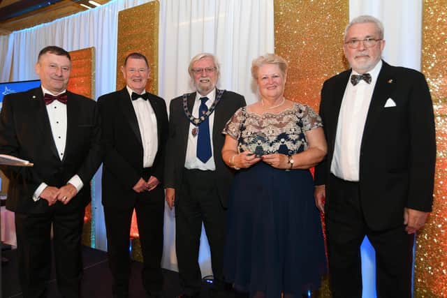 Melton Times Best of Melton Awards 2021 presentation evening at Brooksby Hall.  Community Group/Project of the Year winners Melton Mowbray Lions Charity and Volunteers from the MSV Vaccination Centre EMN-211215-083734001