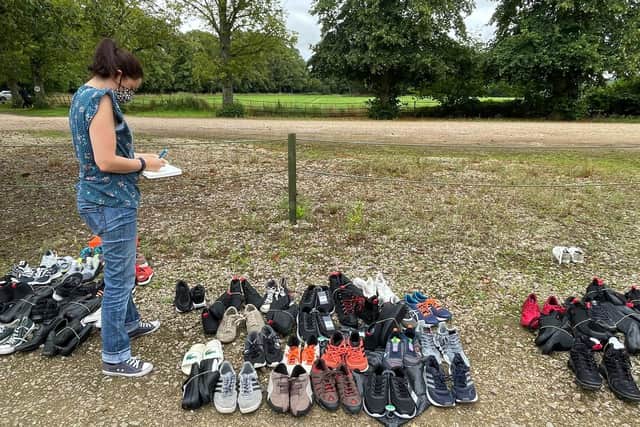 Helen Cliff with donated footwear for the refugees at Scalford hotel EMN-211229-081513001