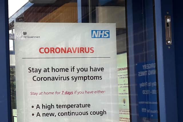 A notice about coronavirus symptoms at Melton's Latham House Medical Practice EMN-211217-160653001