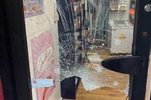 A smashed door at the How Sweet shop in King Street following a break-in EMN-211229-155829001