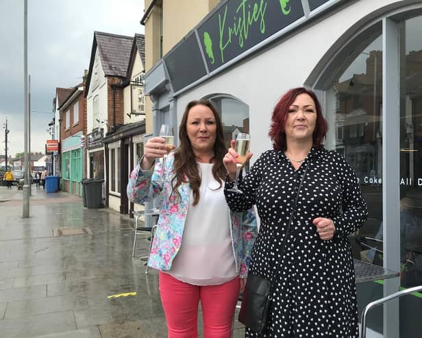 Jolli Waterland (left) outside her new Melton restaurant, Kristie's, with sister Dominique Carnall, mother of the late Kristie Bishop, whose memory inspired the eaterie EMN-211229-081500001