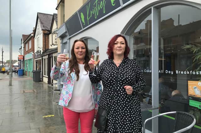 Jolli Waterland (left) outside her new Melton restaurant, Kristie's, with sister Dominique Carnall, mother of the late Kristie Bishop, whose memory inspired the eaterie EMN-211229-081500001