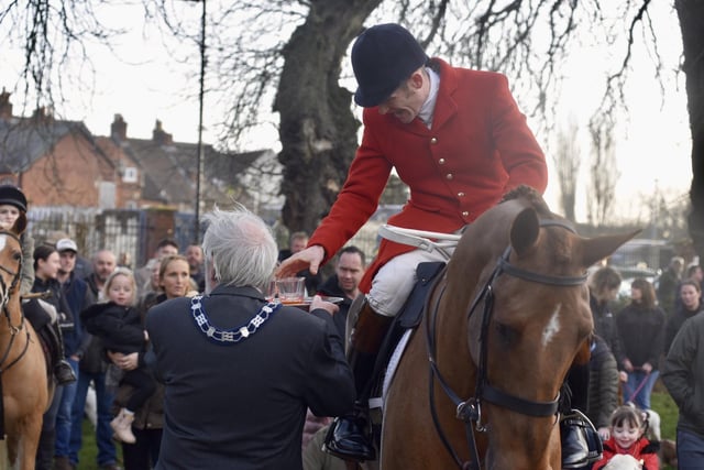 Members of the Quorn Hunt take the stirrup cup from Senior Town Warden Ian Wilkinson at the New Year's Day meet in MeltonPHOTO GEORGE ICKE EMN-220301-114806001