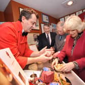 Making traditional Melton Mowbray Pork Pies during their Visit to Ye Olde Pork Pie Shoppe in Melton Mowbray... L-R Stephen Hallam, managing director of Dickinson and Morris, Brian Stein, group chief executive of Samworth Brothers, Prince Charles and the Duchess of Cornwall EMN-220124-154543001