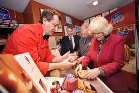 Making traditional Melton Mowbray Pork Pies during their Visit to Ye Olde Pork Pie Shoppe in Melton Mowbray... L-R Stephen Hallam, managing director of Dickinson and Morris, Brian Stein, group chief executive of Samworth Brothers, Prince Charles and the Duchess of Cornwall EMN-220124-154543001
