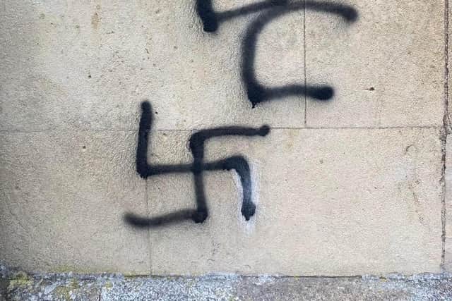 Graffiti including a Nazi swastika daubed on Melton's historic St Mary's Church today EMN-220125-171737001
