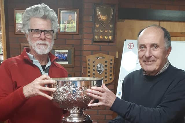 Retiring seniors captain Mike Thornton presents the Bagshaw Bowl to Jim Price (left).