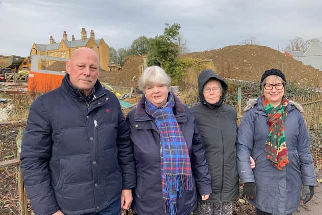 Bob and Jane White with neighbours Linda Croft and Jane Flint, who are some of the unhappy residents living opposite the protracted building work at the old War Memorial Hospital site on Ankle Hill EMN-220802-102106001