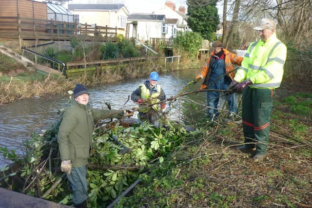 Members of Melton & Oakham Waterways Society (MOWS) unloading Badger, one of three workboats owned by the group, on the River Eye, from left, Gerry Filor, Mick Clowes, Mark Percival and Stuart Lock EMN-220214-120226001