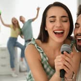 Couple singing romantic ballads on the Karaoke
