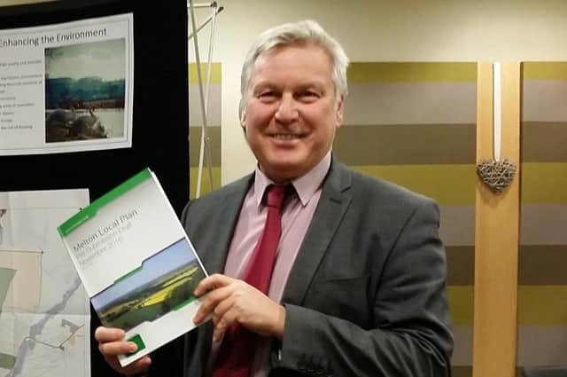 Jim Worley, Melton Council's then head of regulatory services, hold a copy of Melton's draft Local Plan document at a public consultation event back in 2016 EMN-220221-113637001