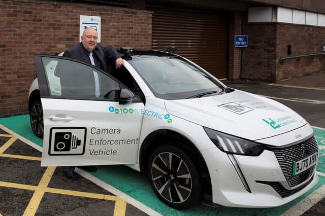Councillor Ozzy O'Shea with one of Leicestershire County Council's camera cars which enforce illegal parking offences near schools EMN-220217-093619001