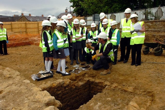 Schoolchildren being shown around the building site for what would become the restaurants in May 2010