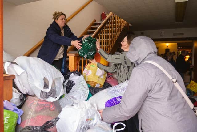 Women sorting through the piles of donations for the relief effort for Ukrainian refugees organised at the Polish Club in Melton

PHOTO ADAM SHAW EMN-220803-134138001