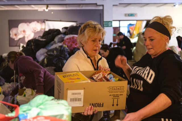 Women sorting through the piles of donations for the relief effort for Ukrainian refugees organised at the Polish Club in Melton

PHOTO ADAM SHAW EMN-220803-134159001