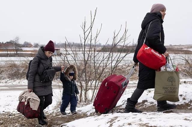 KRAKOVETS, UKRAINE - MARCH 09: Refugees fleeing conflict make their way to the Krakovets border crossing with Poland on March 09, 2022 in Krakovets, Ukraine. (Photo by Dan Kitwood/Getty Images) (Photo by Dan Kitwood/Getty Images) EMN-221003-161803001