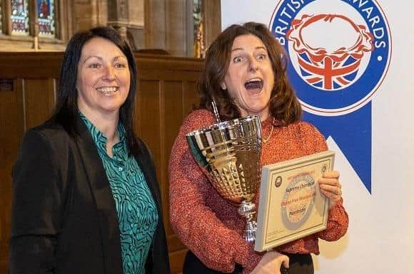 Rachel Kolebuk, chief customer officer of Melton Mowbray Building Society presents the Supreme Champion Award to Romany Simon of Pieminister at the 2022 British Pie Awards at Melton EMN-220314-131912001