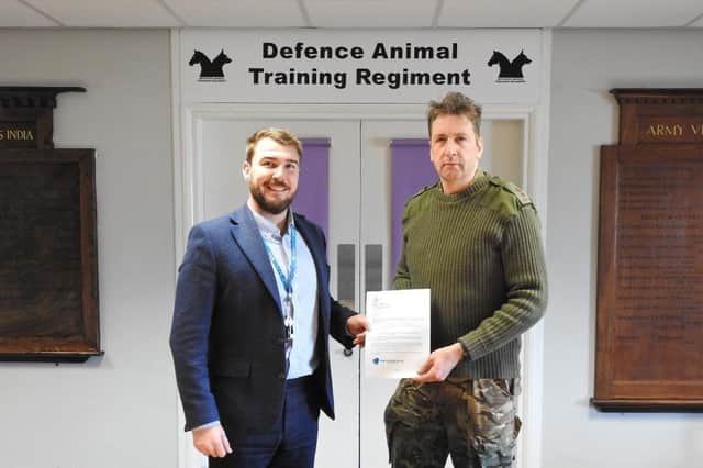 Commanding Officer of the Defence Animal Training Regiment, Lt Col Mike Robinson (right) and James Thorne, Assistant Principal at SMB College Group, sign the new formal partnership between the organisations EMN-220315-171903001