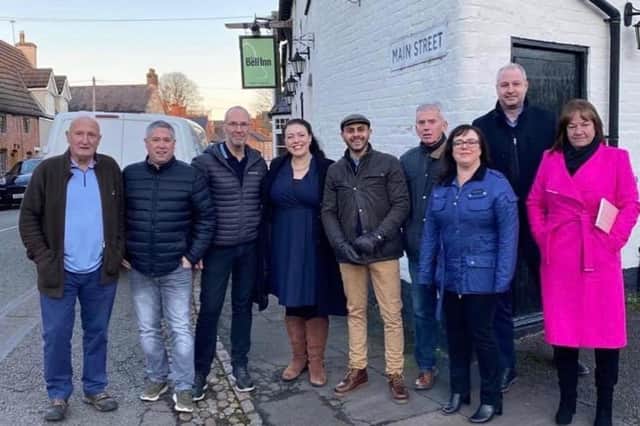 Villagers who have bought the Bell Inn at Frisby to retain it as a community asset with Melton MP, Alicia Kearns EMN-220324-150031001