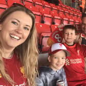 Graham and Kirsty Wells with son, Fletcher and his friend, Austin, pictured at Anfield during their dream trip to see their beloved Liverpool play Barcelona in a legends charity match EMN-220329-124125001