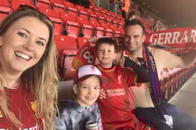 Graham and Kirsty Wells with son, Fletcher and his friend, Austin, pictured at Anfield during their dream trip to see their beloved Liverpool play Barcelona in a legends charity match EMN-220329-124125001