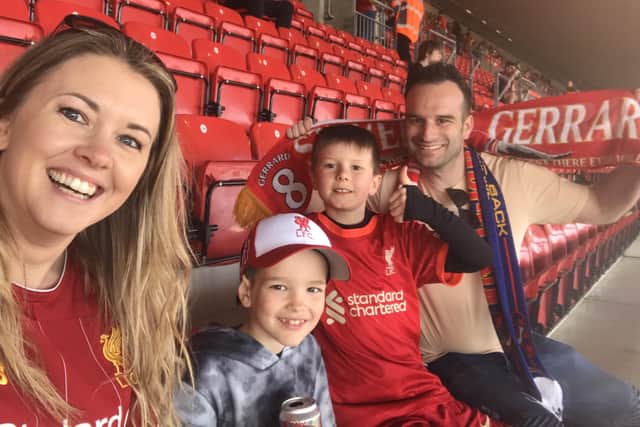 Graham and Kirsty Wells with son, Fletcher and his friend, Austin, pictured at Anfield during their dream trip to see their beloved Liverpool play Barcelona in a legends charity match EMN-220329-124125001