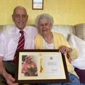 Bob and Brenda Gathercole celebrate their 70th wedding anniversary with their framed congratulations card from The Queen EMN-220404-171104001