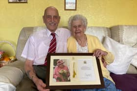 Bob and Brenda Gathercole celebrate their 70th wedding anniversary with their framed congratulations card from The Queen EMN-220404-171104001