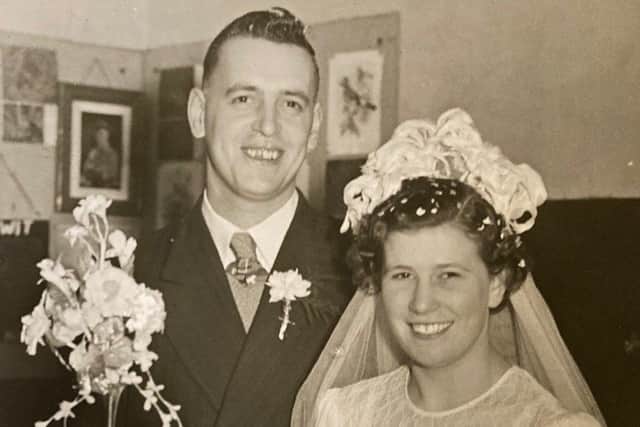 Bob and Brenda Gathercole with their wedding cake on their big day in March 1952 EMN-220404-171114001